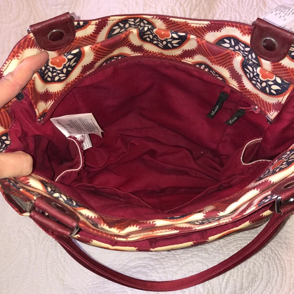 Petunia Pickle Bottom Red and Brown Kids Diaper Bag with Fold-Out Changing Pad